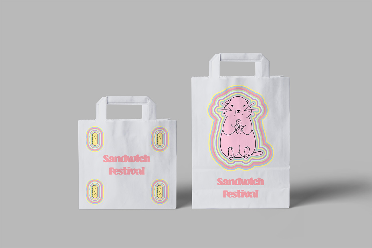 emballages papier avec l'identité visuelle et la mascotte du sandwich festival